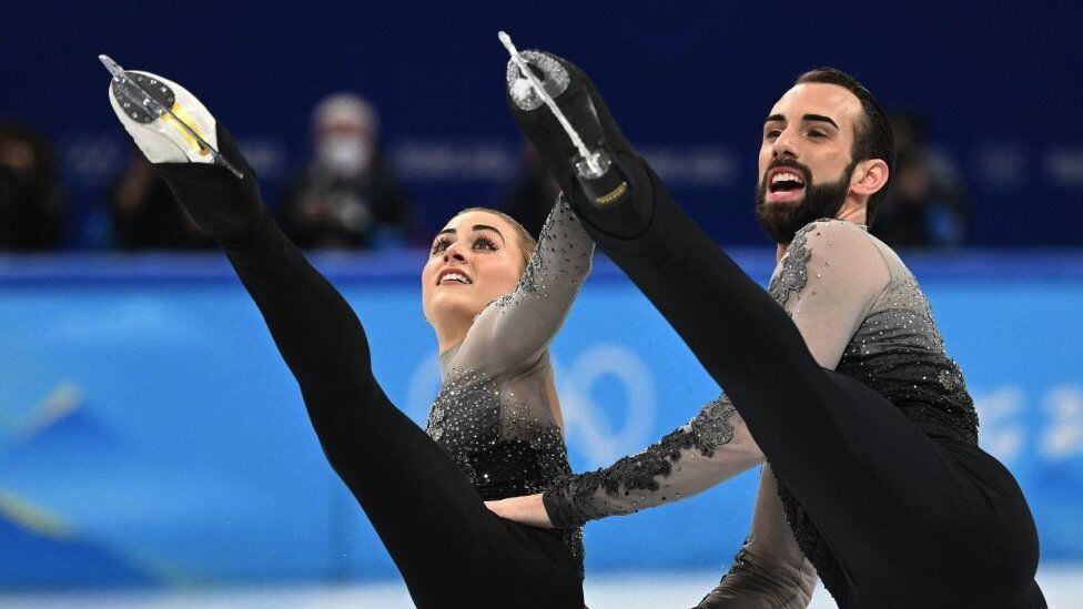 LeDuc (right) became the first non-binary person to compete in the Winter Olympics.  (GETTY IMAGES).