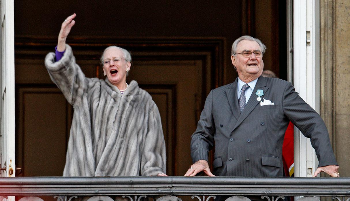 FILE - In this Jan. 15, 2012 file photo, Queen Margrethe, left, waves to supporters beside her husband Prince Henrik as the royal family appeared on balconies at Amalienborg Palace in Copenhagen. Spain's Crown Princess Letizia has a penchant for haute couture. Queen Elizabeth II's Bentley's are spotless. Belgium's King Albert II maintains a sumptuous villa in the south of France. But believe it or not, many of Europe's royals are feeling a pinch of the austerity sweeping the continent as it deals with its debt crisis. (AP Photo/Polfoto, Jens Dresling, File)  DENMARK OUT