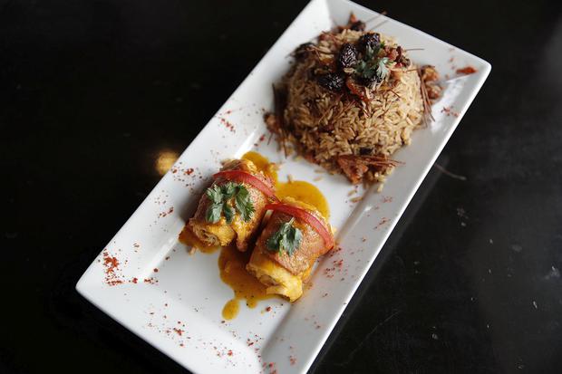 Bacon Wrapped Baked Fish with Arabic Rice.  (Renzo Salazar / GEC)