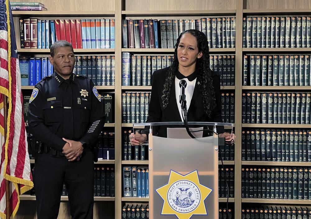 San Francisco District Attorney Brooke Jenkins addresses reporters at a news conference with Police Chief William Scott at her side, Monday, Oct. 31, 2022. (AP Photo/Terry Chea)