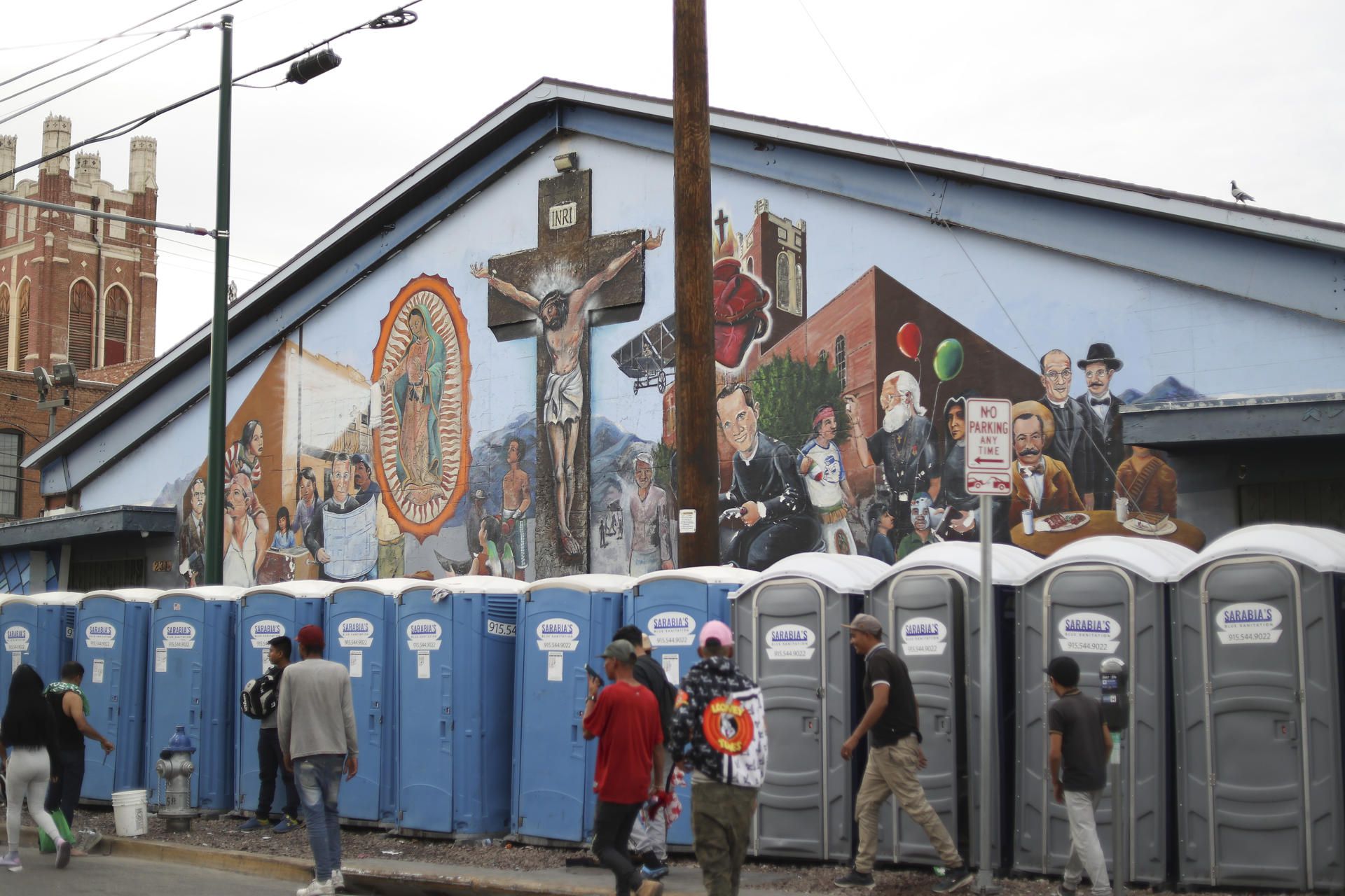 Migrants use portable toilets on Wednesday, May 3, 2023, in El Paso, Texas.  (EFE/ Jesus Rosales).