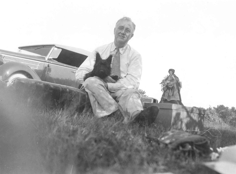 President Roosevelt and Fala, four months old, at a picnic near Pine Plains, New York, on August 8, 1940. (Photo: US National Archives)