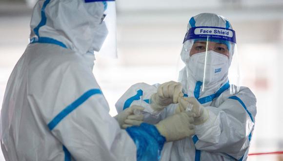 Japón exige a China que deje de hacer test anales de coronavirus a sus nacionales. (Foto referencial, ISAAC LAWRENCE / AFP).