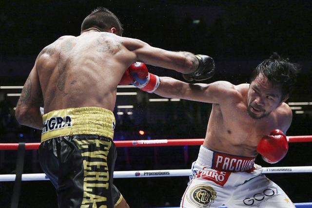 El boxeador filipino de 39 años Manny Pacquiao venció al argentino Lucas Matthysse y se consagró campeón mundial welter AMB. Miras las mejores imágenes de la pelea. (Foto: AP)
