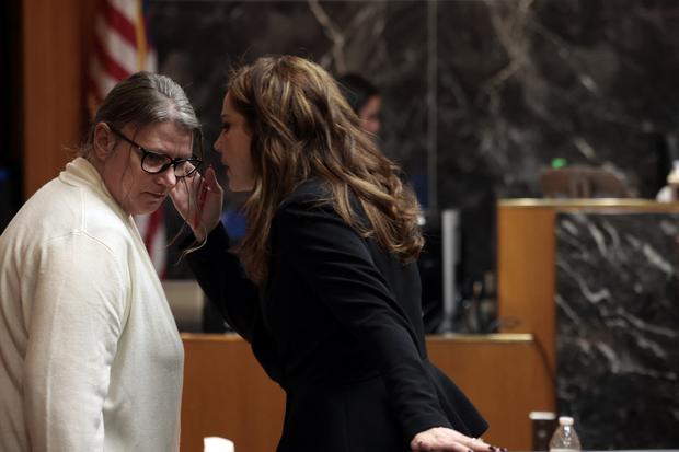 Jennifer Crumbley speaks with attorney Shannon Smith in the Oakland County courtroom in Pontiac, Michigan, on February 5, 2024. (Photo by JEFF KOWALSKY / AFP).