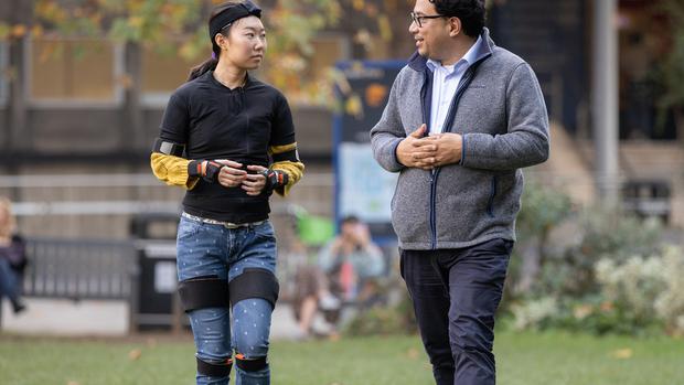 Professor Aldo Faisal (right) is developing sensors that can track movement outdoors and in everyday situations outside the clinic.  (THMOAS ANGUS/IMPERIAL COLLEGE)
