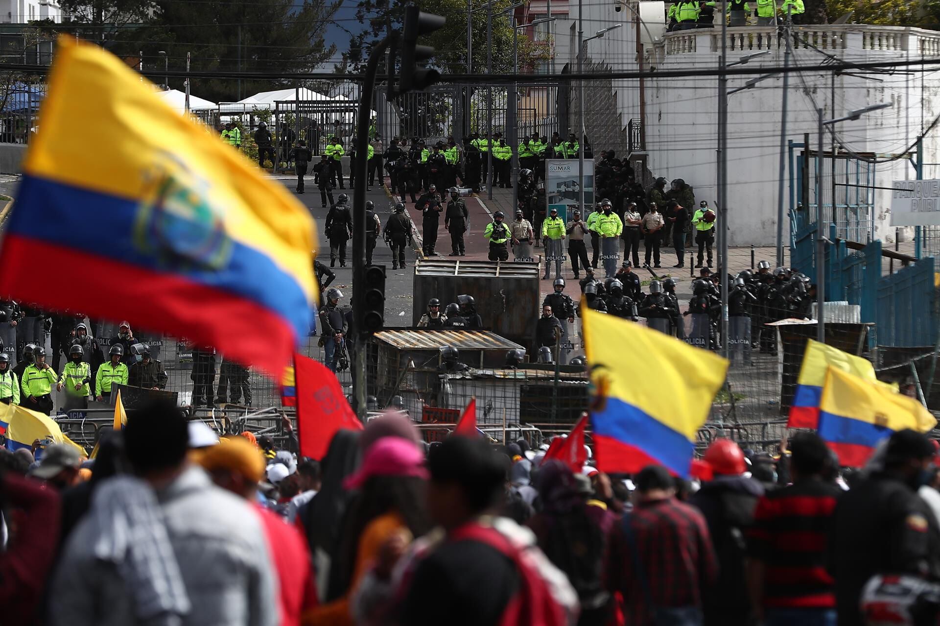 Dozens of police and riot police stand guard during the national strike called by the Confederation of Indigenous Nationalities of Ecuador.  (EFE/ José Jácome).