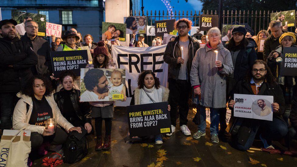 One of Alaa Abdel Fattah's sisters, Mona Seif, takes part in a vigil outside Downing Street demanding the activist's release.