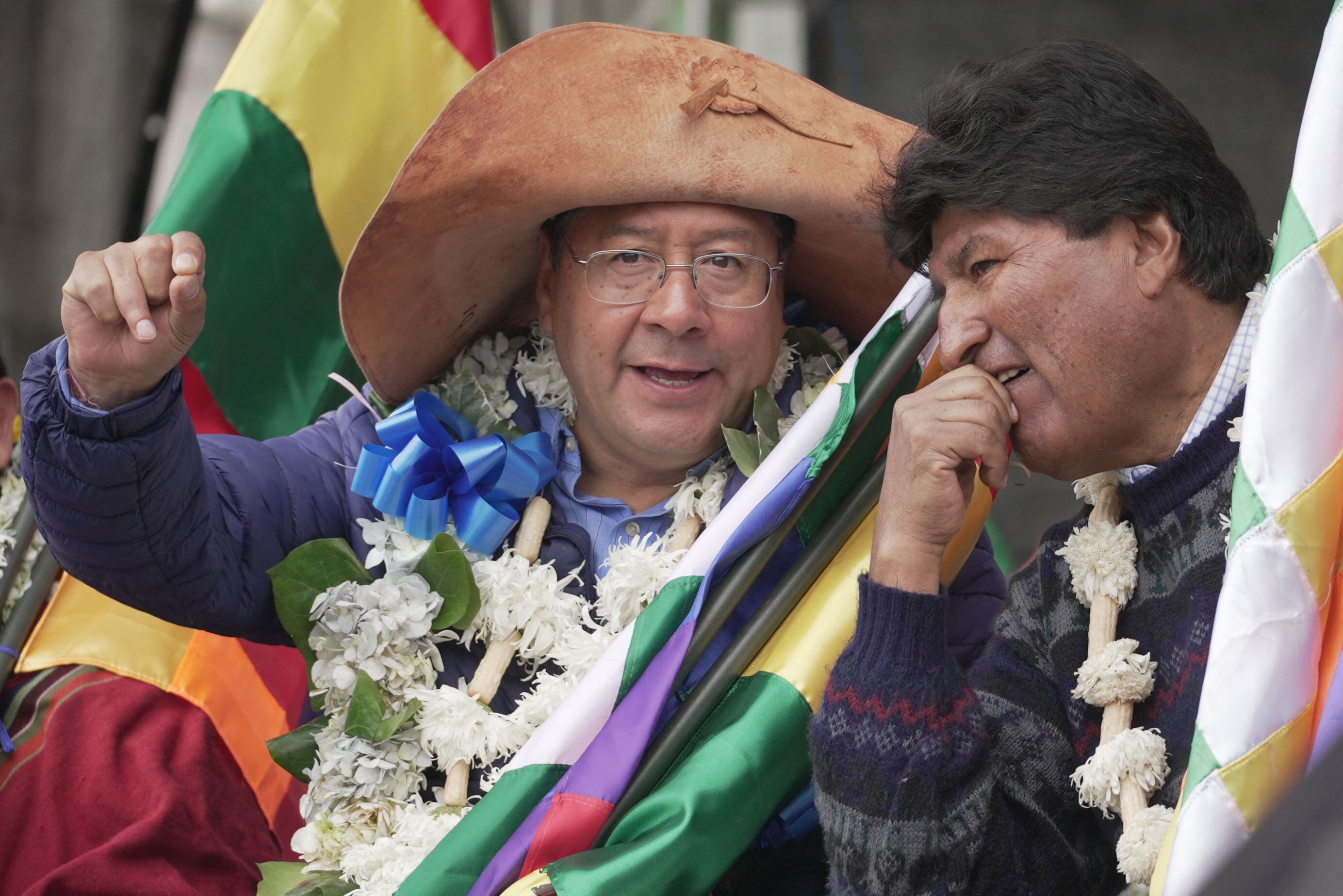 Bolivian President Luis Arce talks with former President Evo Morales during a demonstration in support of the government in La Paz, in November 2021. (Photo by Aizar RALDES / AFP)