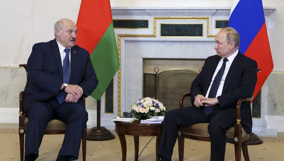 Russian President Vladimir Putin, right, listens to Belarusian President Alexander Lukashenko during their meeting in St. Petersburg, Russia, Saturday, June 25, 2022. (Mikhail Metzel, Sputnik, Kremlin Pool Photo via AP)