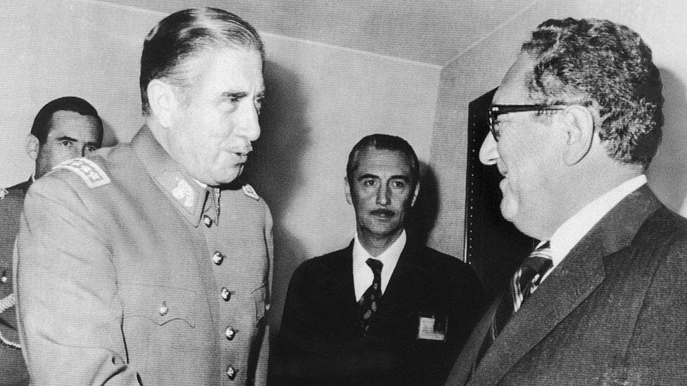 Kissinger met Pinochet in Chile in 1976, three years after Allende's overthrow.  (GETTY IMAGES).