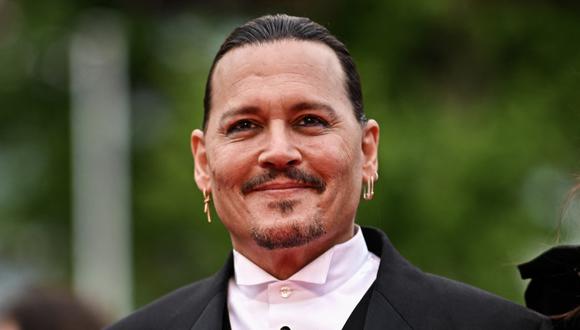 Johnny Depp regresó por todo lo alto a la alfombra roja del festival de Cannes. (Foto: AFP)