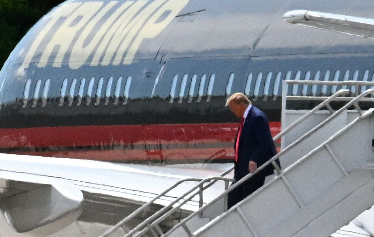 Donald Trump disembarks from 