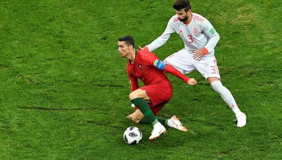 Piqué y Cristiano Ronaldo. (Foto: AFP)