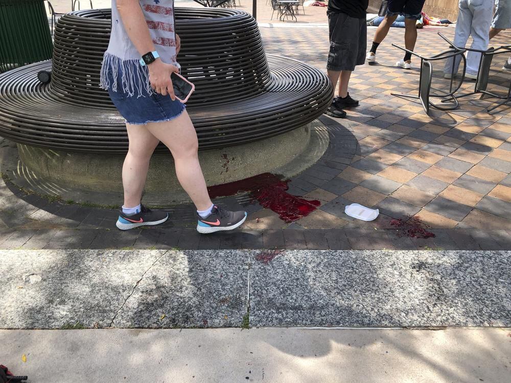 Blood trails at the scene of the shooting in Highland Park, Illinois.  (Lynn Sweet/Chicago Sun-Times via AP)