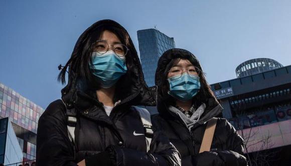 Es muy frecuente ver a personas con mascarillas en las calles de distintas ciudades chinas. (Foto: AFP)