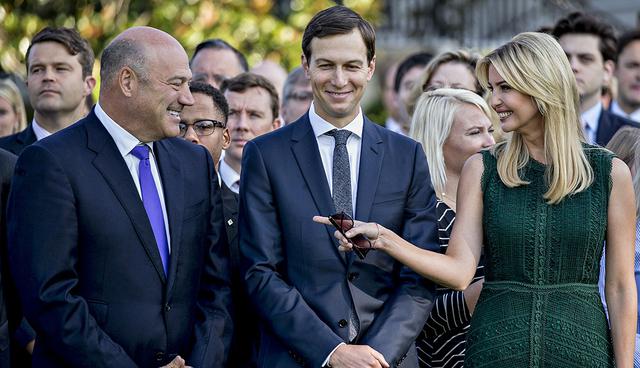 Gary Cohn, director of the U.S. National Economic Council, left, speaks with Ivanka Trump, assistant to U.S. President Donald Trump, right, and Jared Kushner, senior White House adviser, before a moment of silence with U.S. President Donald Trump, not pictured, in remembrance of those lost during the September 11, 2001 terrorist attacks, on the South Lawn of the White House in Washington, D.C., U.S., on Monday, Sept. 11, 2017. Trump is presiding over his first 9/11 commemoration on the 16th anniversary of the terrorist attacks that killed nearly 3,000 people when hijackers flew commercial airplanes into New York's World Trade Center, the Pentagon and a field near Shanksville, Pennsylvania. Photographer: Andrew Harrer/Bloomberg