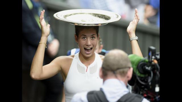 Mugurza muestra su título al mundo.
(Foto: Agencias / Wimbledon)