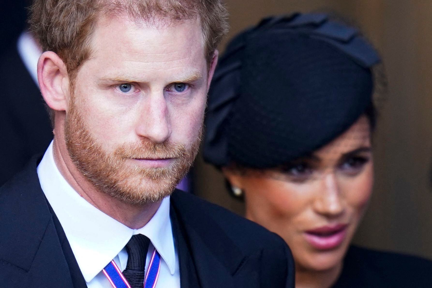 Prince Harry and his wife Meghan Markle leave after a service for the reception of Queen Elizabeth II's coffin in Westminster Hall at the Palace of Westminster on September 14, 2022. (Photo by Danny Lawson/AFP)