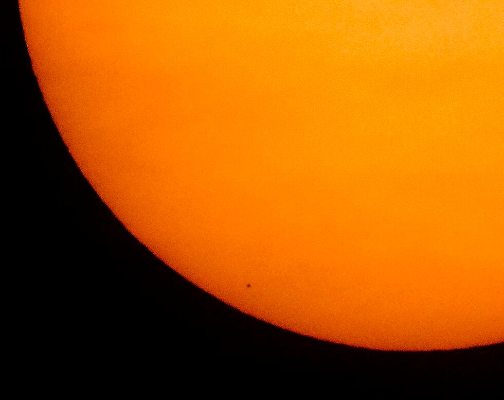 The image shows the impressive size difference between Mercury and the Sun.