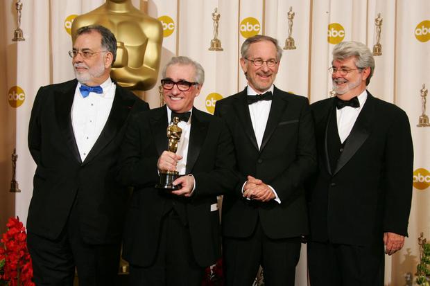 Martin Scorsese (second from left) receives his first Oscar for Best Director for the film "The Departed."  Beside him are his friends and colleagues (from left to right) Francis Ford Copola, Steven Spielberg and George Lucas, who presented him with the award.  (Photo: ROBYN BECK/AFP)