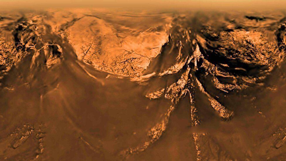 A view of Titan taken by ESA's Huygens probe as it descended to its surface.  (WHAT).