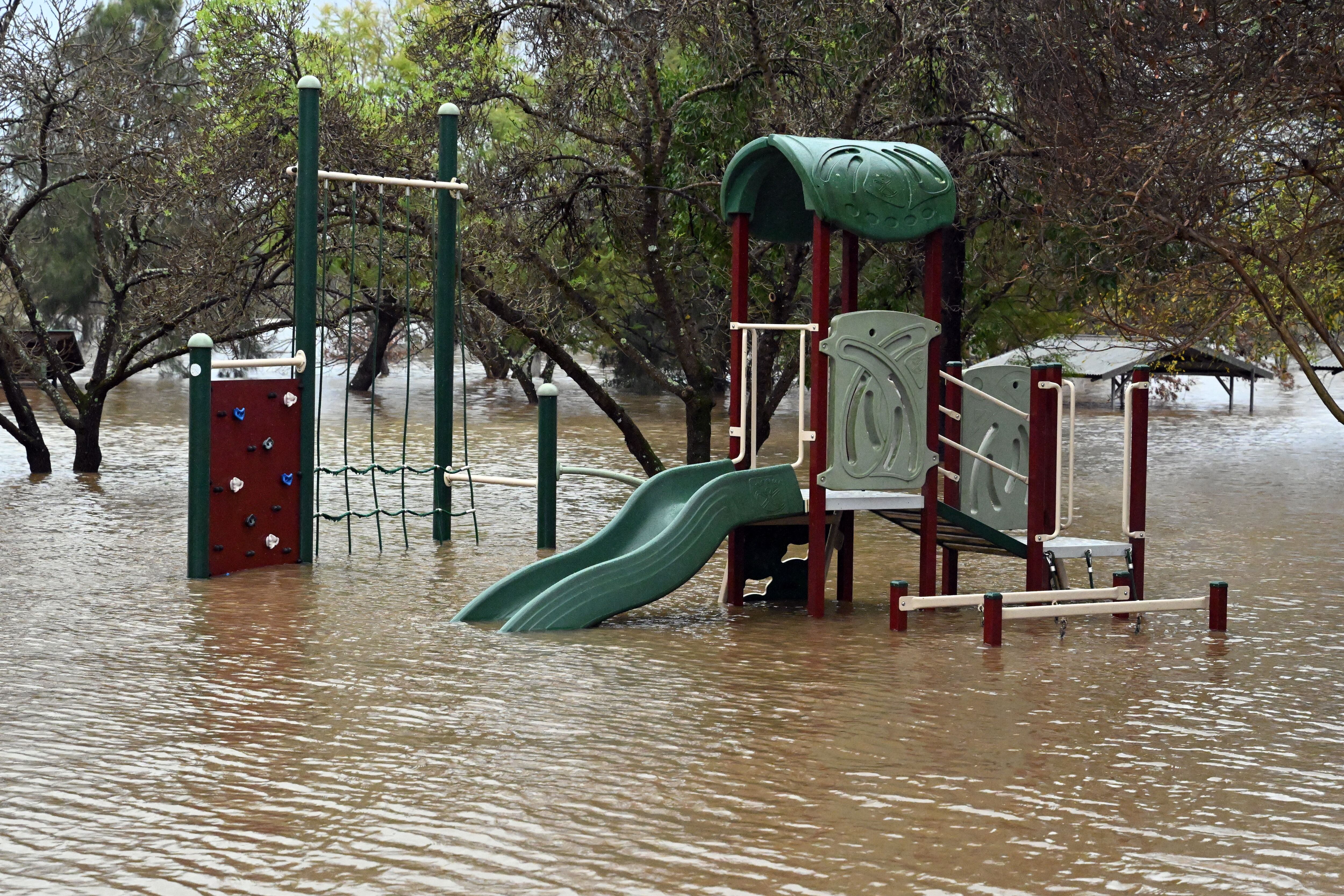 A children's play area is seen inundated by floodwaters in Camden, south-west Sydney, Australia.