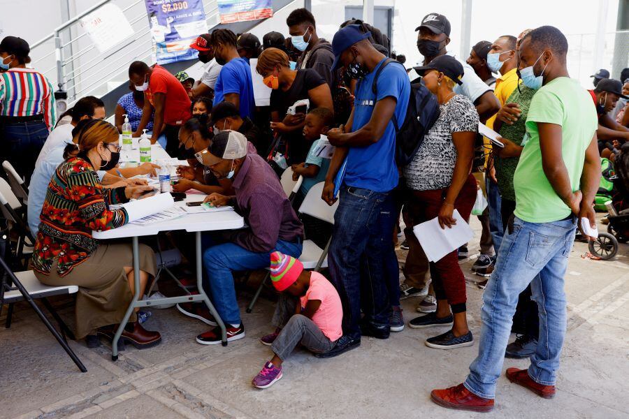 Migrants from Haiti, seeking to reach the U.S., register to seek work and shelter, outside the office of the Center for Comprehensive Attention to Migrants (CAIM) in Ciudad Juárez, Mexico, May 4, 2022.