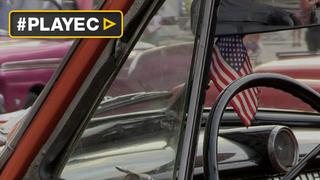 Cubanos lucen la bandera de Estados Unidos a la espera de Obama