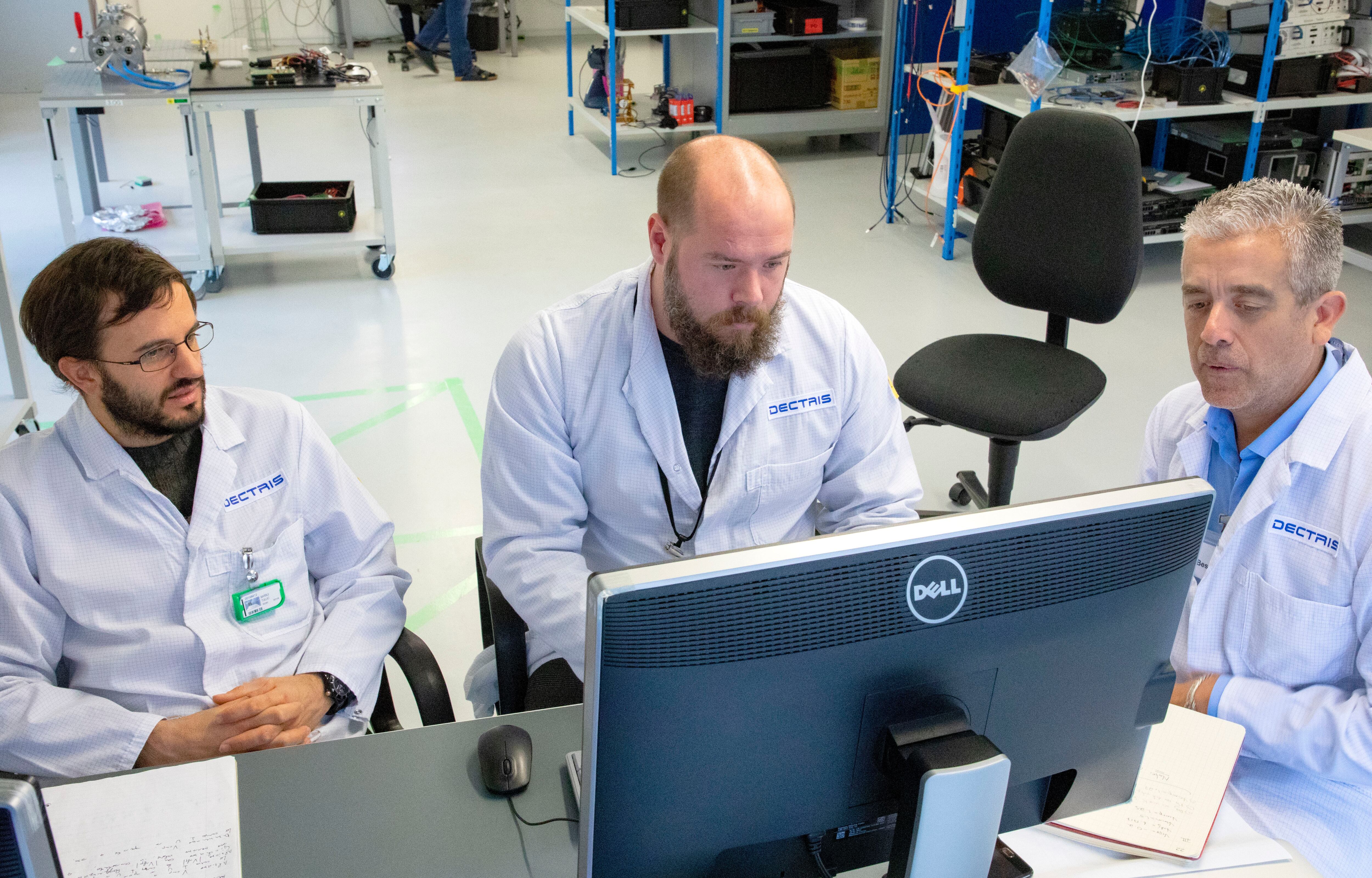 Tullio Barbui, Novimir Pablant and Luis Delgado-Aparicio of PPPL work on their multi-energy soft X-ray detector (ME-SXR) at DECTRIS, the company that manufactured the device on which their detection system was based.  (Photo: PPPL)