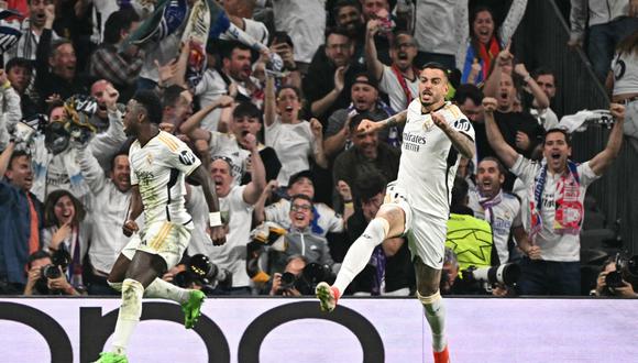 Real Madrid's Spanish forward #14 Joselu (R) celebrates scoring the equalizing goal during the UEFA Champions League semi final second leg football match between Real Madrid CF and FC Bayern Munich at the Santiago Bernabeu stadium in Madrid on May 8, 2024. (Photo by JAVIER SORIANO / AFP)