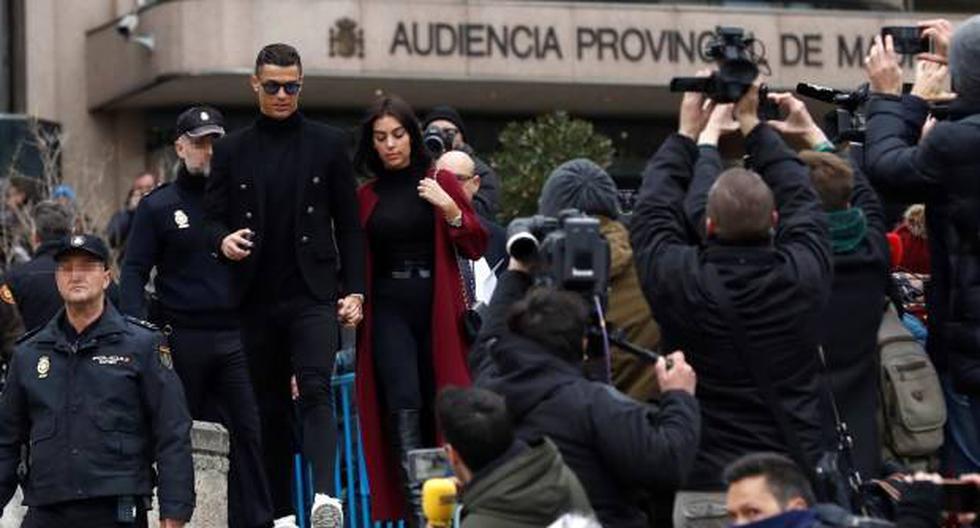 El exjugador del Real Madrid Cristiano Ronaldo , junto a su pareja Georgina Rodríguez, a la salida este martes a la Audiencia Provincial de Madrid. (Foto: EFE)