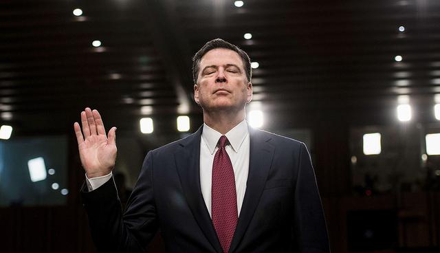 Ousted FBI director James Comey is sworn in during a hearing before the Senate Select Committee on Intelligence on Capitol Hill June 8, 2017 in Washington, DC. Fired FBI director James Comey took the stand Thursday in a crucial Senate hearing, repeating explosive allegations that President Donald Trump badgered him over the highly sensitive investigation Russia's meddling in the 2016 election. / AFP / Brendan Smialowski