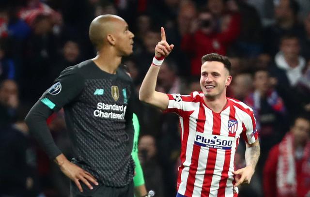 Soccer Football - Champions League - Round of 16 First Leg - Atletico Madrid v Liverpool - Wanda Metropolitano, Madrid, Spain - February 18, 2020  Atletico Madrid's Saul Niguez celebrates scoring their first goal as Liverpool's Fabinho looks dejected   REUTERS/Sergio Perez