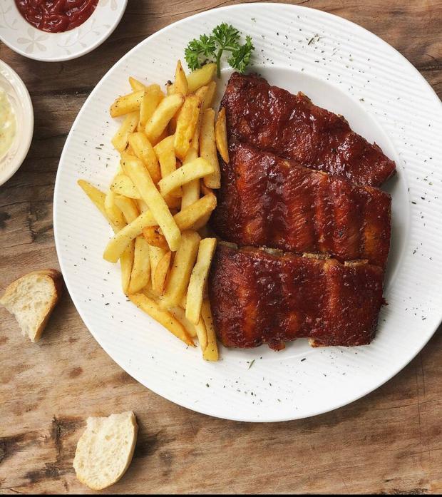   BBQ ribs with crispy fine herbs fries.