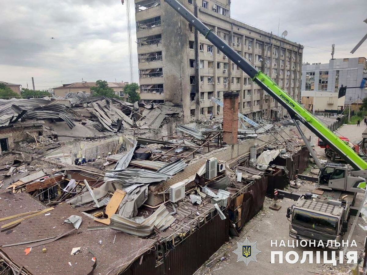 Rescuers work at the site of a rocket attack in the center of Kramatorsk, Donetsk area, Ukraine, on June 28, 2023, amid the Russian invasion.  (Photo by EFE/EPA/UKRAINE NATIONAL POLICE)
