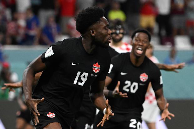 Canada's forward #19 Alphonso Davies celebrates scoring his team's first goal during the Qatar 2022 World Cup Group F football match between Croatia and Canada at the Khalifa International Stadium in Doha on November 27, 2022. (Photo by OZAN KOSE / AFP)

