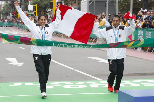 Lima, Saturday July 27, 2019  -  Peruvian runners and marathon race winners, Christian Pacheco and Gladys Tejada, rise their hands and simulate crossing the finish line after  the Marathon competition during Pan American Games Lima 2019 at Parque Kennedy.
Copyright Vidal Tarqui / Lima 2019 

Mandatory credits: Lima 2019
** NO SALES ** NO ARCHIVES **