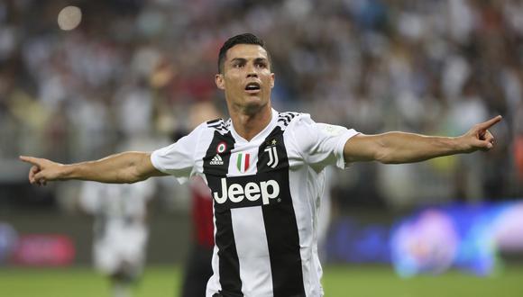 Juventus se impuso por la mínima diferencia ante AC Milan y se quedó con su primer trofeo del año en el primer en el King Abdullah Sports City con anotación del portugués. (Foto: AP)
