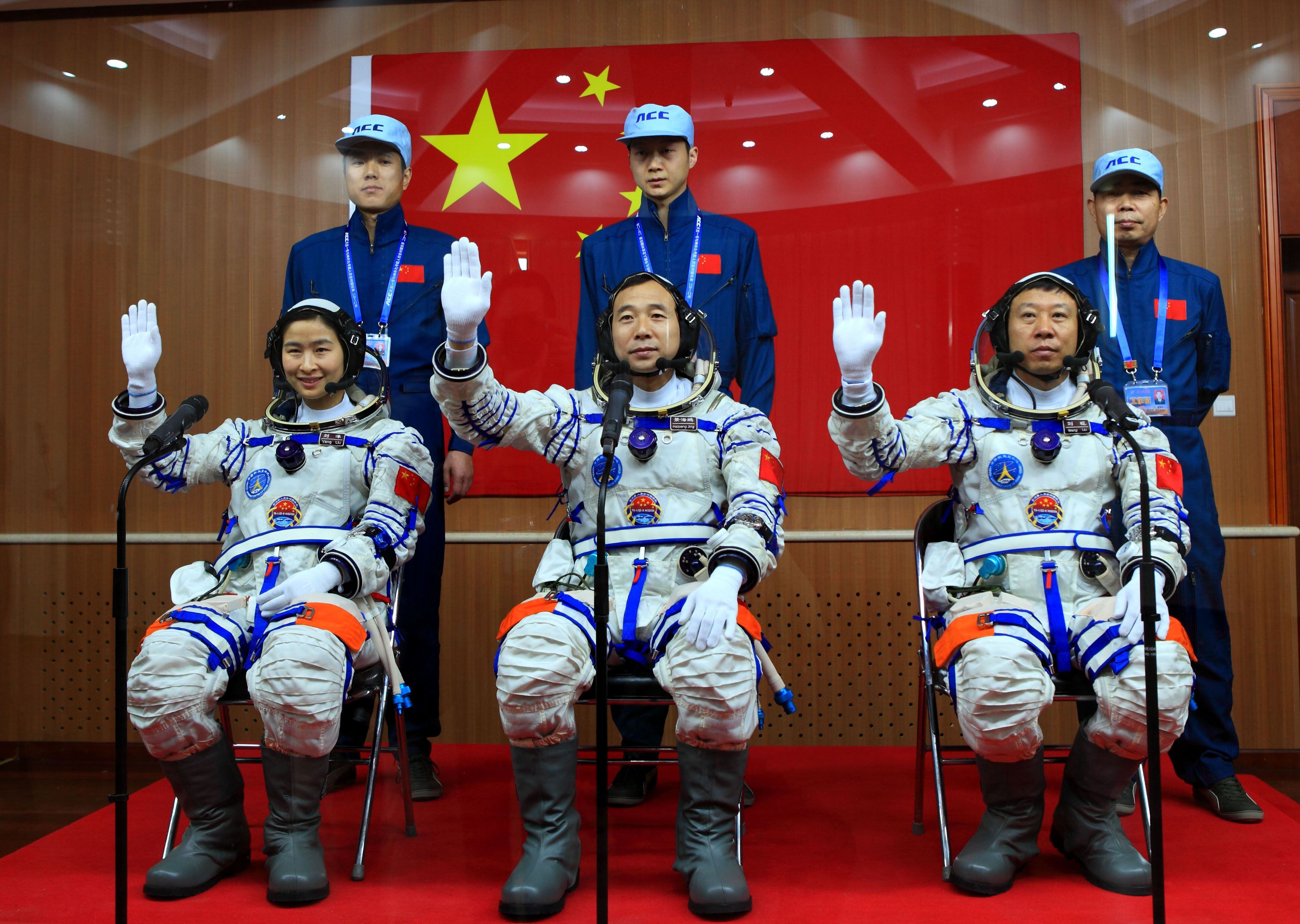 In this 2012 photo, three Chinese astronauts, including Liu Yang, the country's first female astronaut, pose for an official photo.  AFP