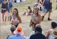 Hombre intenta tocar a mujer en topless y recibe tremenda paliza