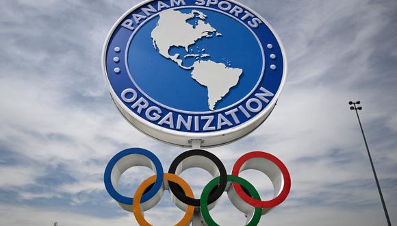 (FILES) Picture of the Olympic Rings and the logo of Panam Sports taken at the National Stadium Sports Park in Santiago on October 19, 2023, ahead of the Pan American Games Santiago 2023. Panam Sports, the entity that organizes the Pan American Games, announced this Wednesday January 3, 2024 that it withdrew the venue of the 2027 competition to Barranquilla, due to "non-compliance" by the Colombian city. (Photo by Raul ARBOLEDA / AFP)
