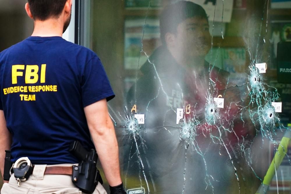 An FBI investigator works at the site of a shooting at a supermarket in Buffalo, N.Y., Monday, May 16, 2022. (AP Photo/Matt Rourke)
