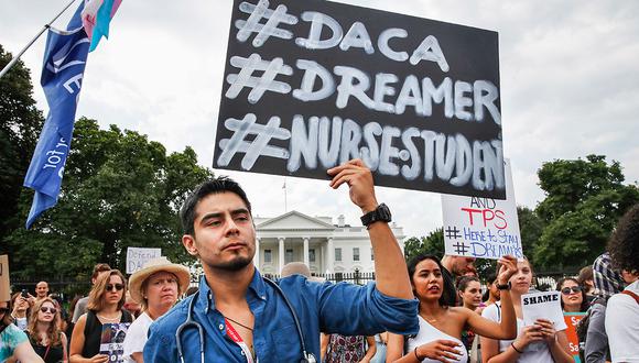 Carlos Esteban, 31, of Woodbridge, Va., a nursing student and recipient of Deferred Action for Childhood Arrivals, known as DACA, rallies with others in support of DACA outside of the White House, in Washington, Tuesday, Sept. 5, 2017. President Donald Trump will end a program that has protected hundreds of thousands of young immigrants brought into the country illegally as children and call for Congress to find a legislative solution.  (AP Photo/Jacquelyn Martin)