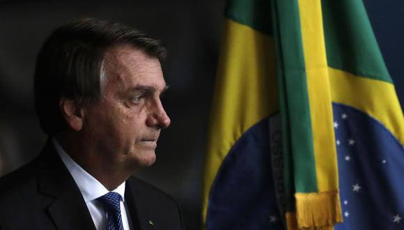 El presidente de Brasil, Jair Bolsonaro, llega al Ministerio de Justicia para asistir a la toma de posesión del nuevo defensor público, en Brasilia. (AP/Eraldo Peres).