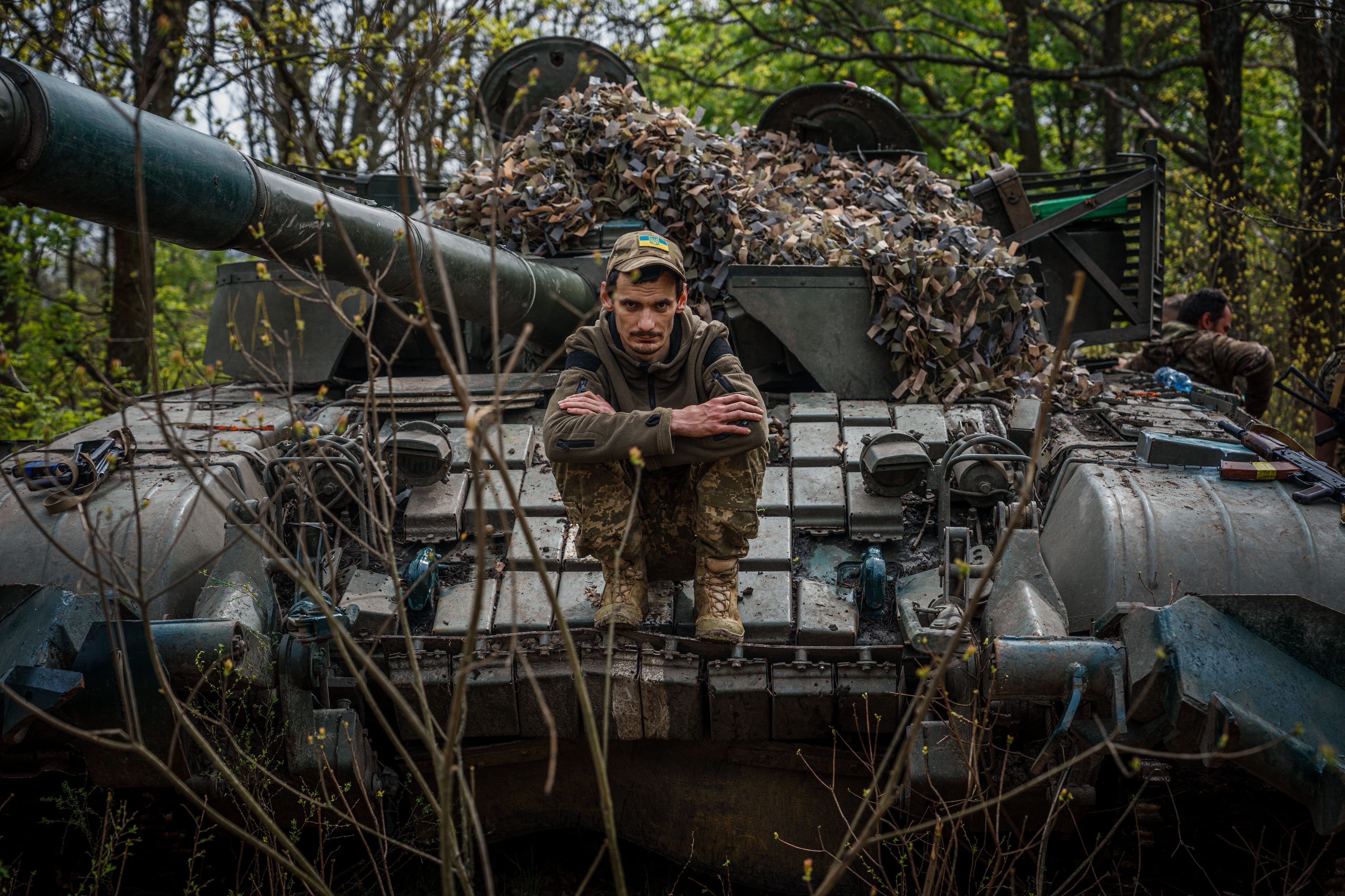 A Ukrainian serviceman sits in his tank in a position near the town of Bakhmut, Donetsk region, on April 29, 2023. (Photo by Dimitar DILKOFF / AFP)
