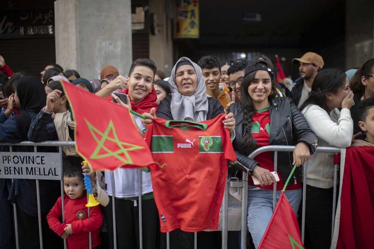 Supporters of the Moroccan soccer team celebrate the return of the players from the 2022 FIFA World Cup soccer tournament in Qatar, in Rabat, Morocco, on December 20, 2022. (Photo by EFE/EPA/Jalal Morchidi )