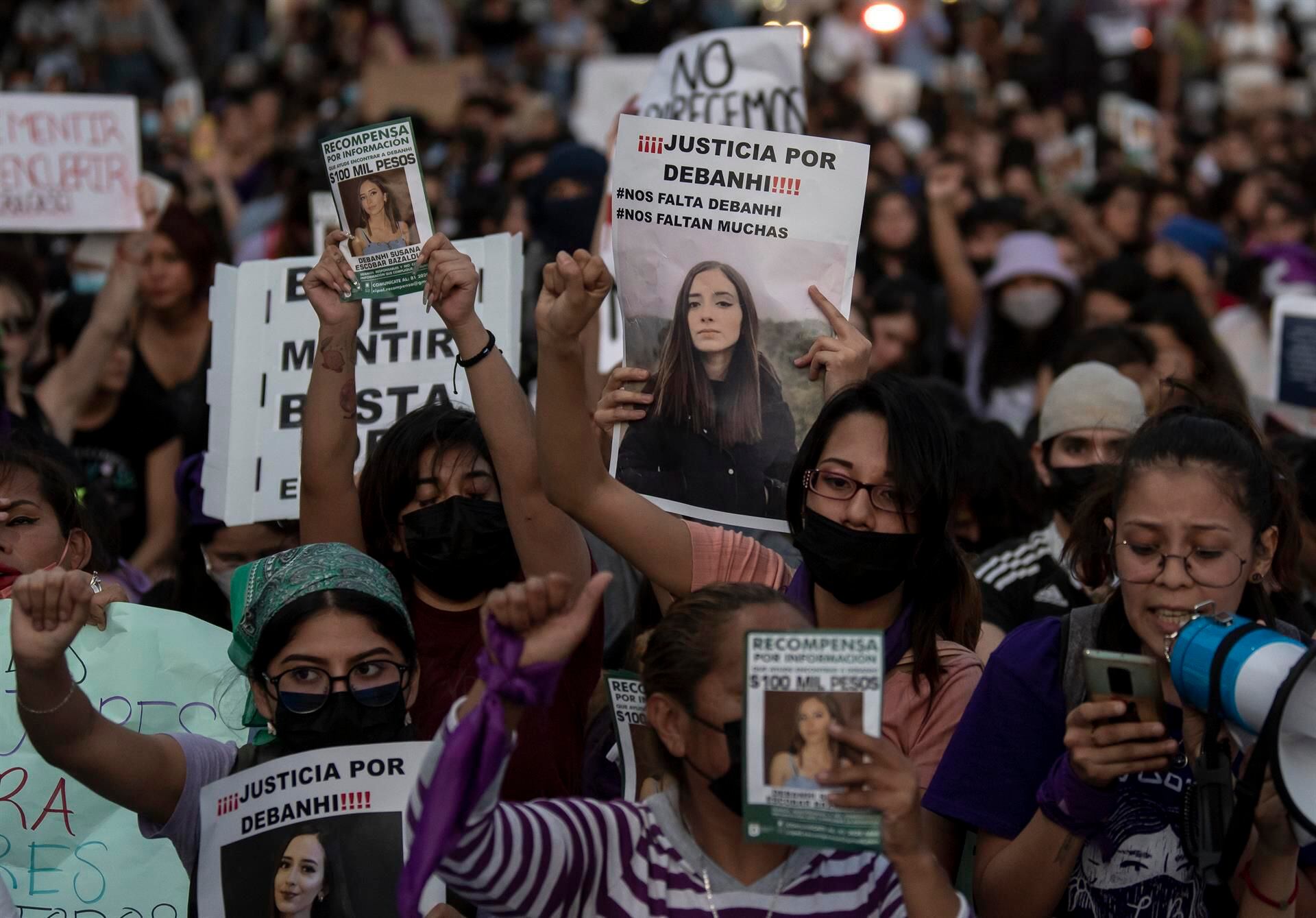 Several women march during a protest on April 22, 2022, in Monterrey, Mexico, with the photo of the young Debanhi Escobar.  (EFE / Miguel Sierra).