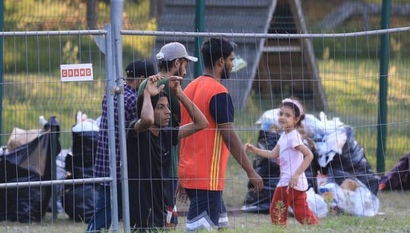 Migrantes en la frontera entre Bielorrusia y Lituania. (GETTY IMAGES).