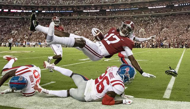 Sep 30, 2017; Tuscaloosa, AL, USA; Alabama Crimson Tide wide receiver Cam Sims (17) is knocked out of bounds by Mississippi Rebels defensive back C.J. Moore (26) during the first quarter at Bryant-Denny Stadium. Mandatory Credit: Marvin Gentry-USA TODAY Sports     TPX IMAGES OF THE DAY